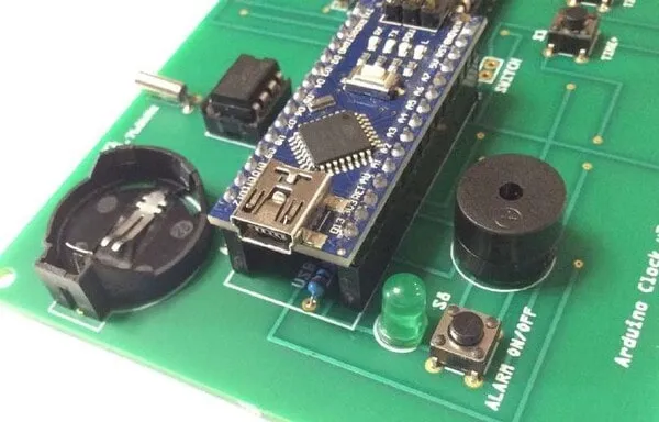 Bend Y1 downward. Then, insert the Arduino Nano into the two long female headers. The USB port should be over the word "USB" on the PCB.